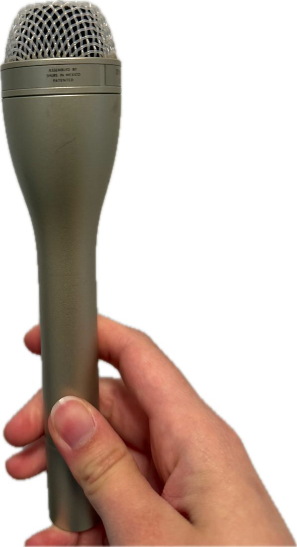 Die-cut hardware specimen of Shure SM61 studio microphone
